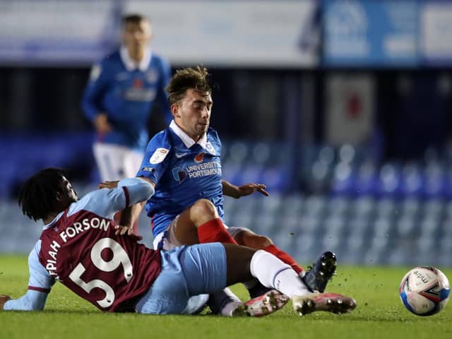 Debutant Charlie Bell, one of a string of Pompey youngsters on display, is tackled by West Ham under-21s' Keenan Appiah-Forson. Picture: Naomi Baker/Getty Images