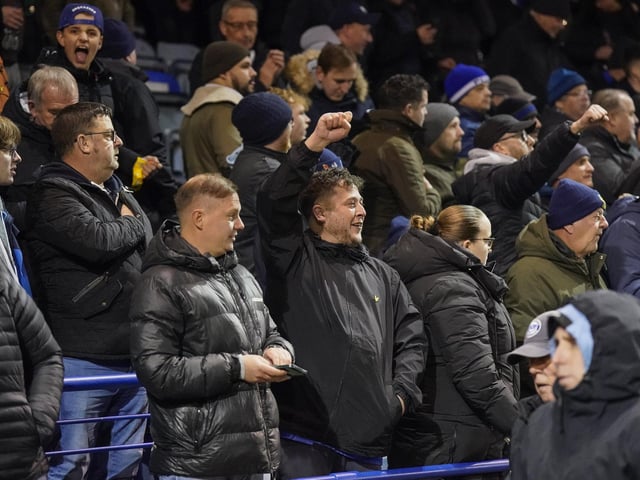 Pompey fans backed their team to a crucial Championship survival win over Cardiff last night.