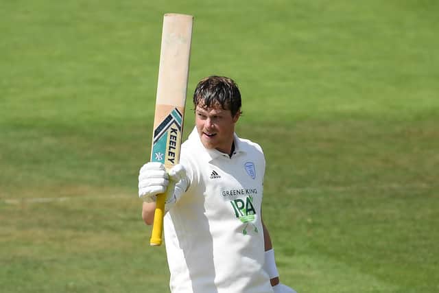 Sam Northeast celebrates a century against Somerset at Taunton last summer. Photo by Alex Davidson/Getty Images.