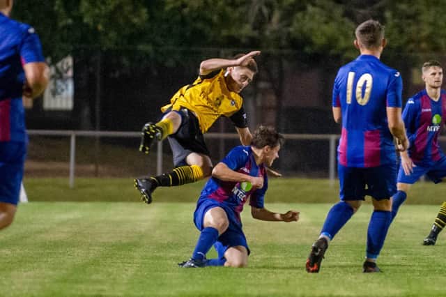 Owen Scammell was booked for this foul on Callum Dart which forced the Baffins midfielder off after lengthy treatment.
Picture: Habibur Rahman