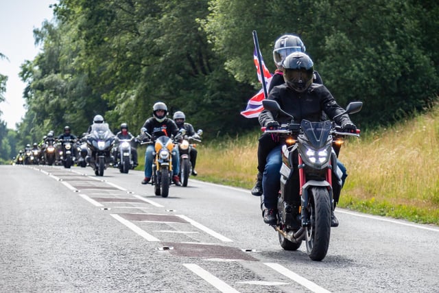 A biker reguard for the convoy of military vehicles heading towards Wickham. Picture: Mike Cooter (240623)