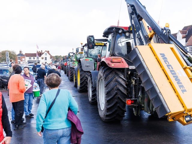 Crowds gathered in Wickham Square to watch the procession of tractors go by all to raise money for Rowans Hospice and Guide Dogs.