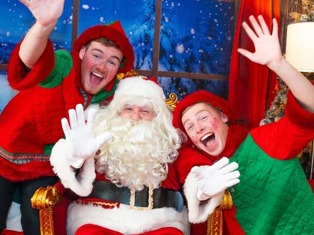 Father Christmas and his elves in the grotto