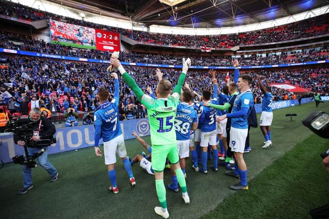 Pompey's players celebrate with fans after claiming the 2019 Checkatrade Trophy - but supporters won't be present for the 2020 final. Picture: Joe Pepler