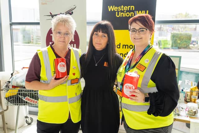 Glenna Bristoe, Monika Russell, Emily Bristoe in front of raffle prizes Photo by Matthew Clark