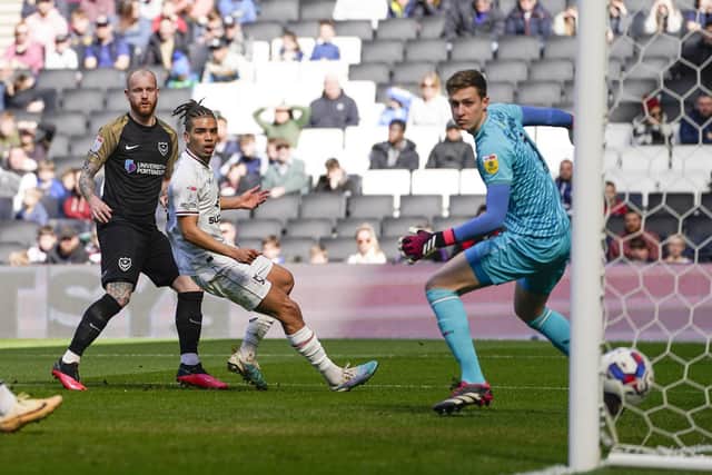 Connor Ogilvie opened the scoring against MK Dons on 14 minutes with a controlled volley from Sean Raggett's cross. Picture: Jason Brown/ProSportsImages