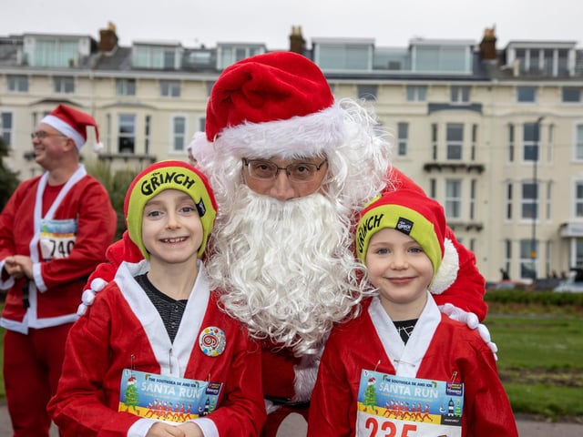 Pictured - Thomas Hayward celebrating his ninth birthday with brother Robin, six, and Father Christmas.