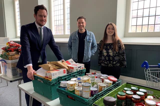 Stephen Morgan with representatives from HIVE Portsmouth at the food depot from where parcels are delivered to vulnerable people.