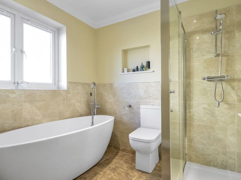 The home has three bathrooms which have a combination of showers and baths throughout.