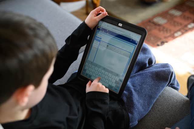 A young boy homeschooling during the pandemic. Photo by Getty Images.