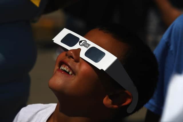 Partial solar eclipse is taking place this morning. (Photo by Bruce Bennett/Getty Images)
