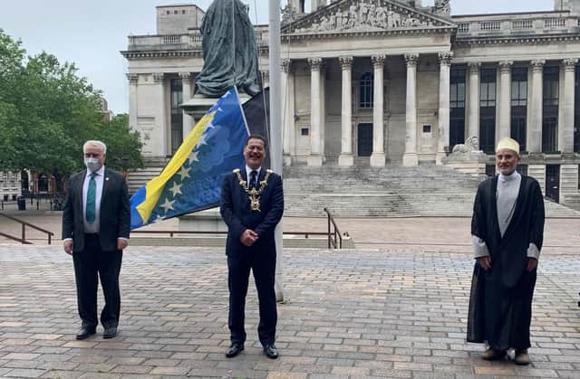 Flags were raised outside Portsmouth Civic Offices to remember the genocide in Srebrenica 25 years ago (L-R Cllr Gerald Vernon-Jackson; Cllr Rob Wood; Sheikh Fazle Abbas Datoo)