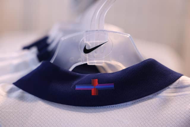The US sportswear firm Nike revealed it had altered the cross, the flag of England, using purple and blue horizontal stripes in what it called a "playful update" ahead of Euro 2024, which starts in June. (Photo by DANIEL LEAL/AFP via Getty Images)