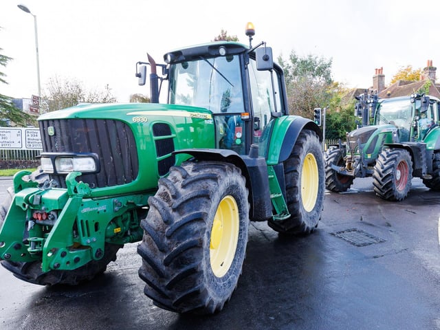 Crowds gathered in Wickham Square to watch the procession of tractors go by all to raise money for Rowans Hospice and Guide Dogs.