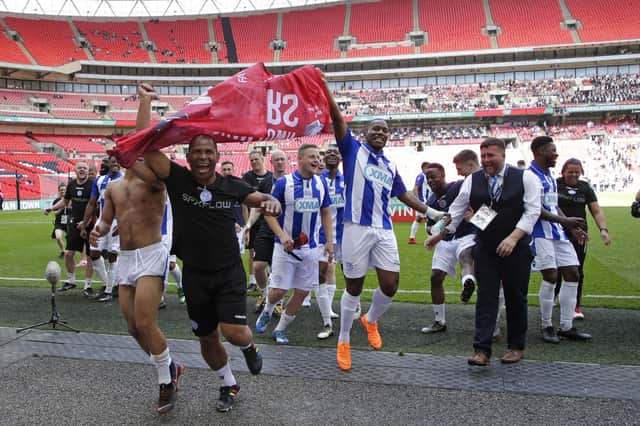 Current Hungerford boss Danny Robinson (right of picture, long sleeved white shirt) celebrates Thatcham Town's FA Vase victory over Stockton at Wembley in 2018. Photo by Henry Browne/Getty Images.