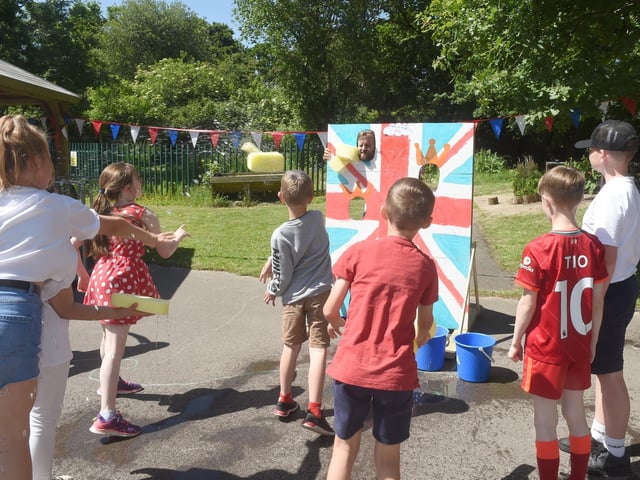 St Columba C of E Primary School in Fareham, celebrated The Queen's Platinum Jubilee. Mr Andrews in the stocks having sponges thrown at him