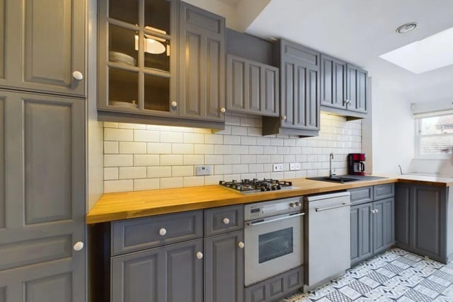 The listing says: "A historically important Grade II listed house that offers gracious living over four storeys comprising 6 double bedrooms, 3 shower/bathrooms, 5 reception rooms and 2 kitchens with an extensive rear courtyard garden, rear access for vehicles and off-street parking in a shared front drive."
