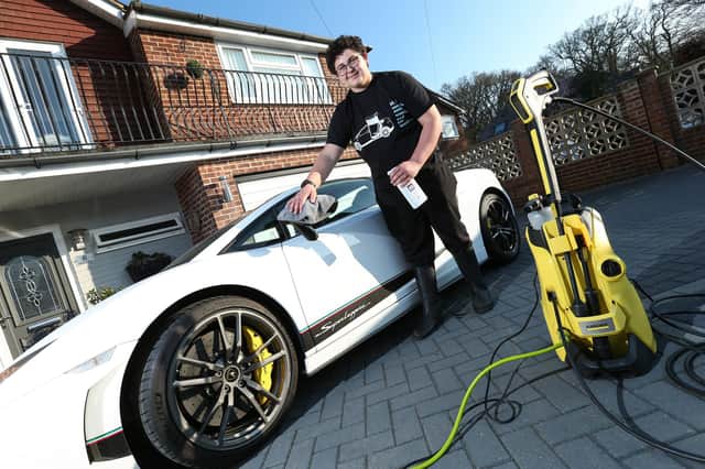 Hugh Clark, 14, has started a car washing business. His aim is to buy his dream car like this Lamborghini Superleggera. Picture: Chris Moorhouse (230321-26)