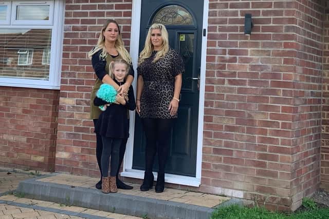 Kirsty Flew (left) with daughter Imogen and Angela Fletcher outside the house burgled in Winterslow Drive.