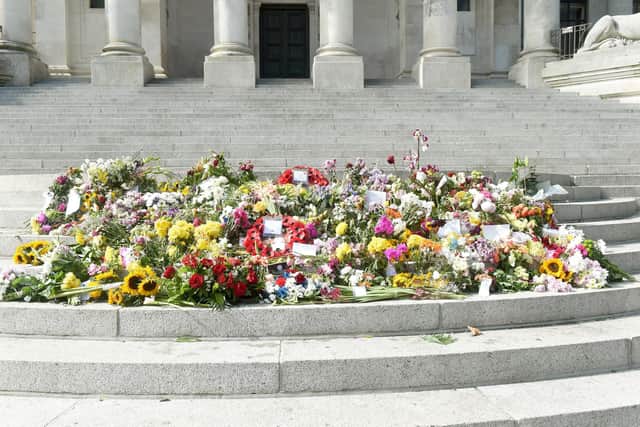 Floral tributes on the Portsmouth Guildhall steps in Guildhall Square, Portsmouth, on Monday, September 12. Picture: Sarah Standing (120922-3278)