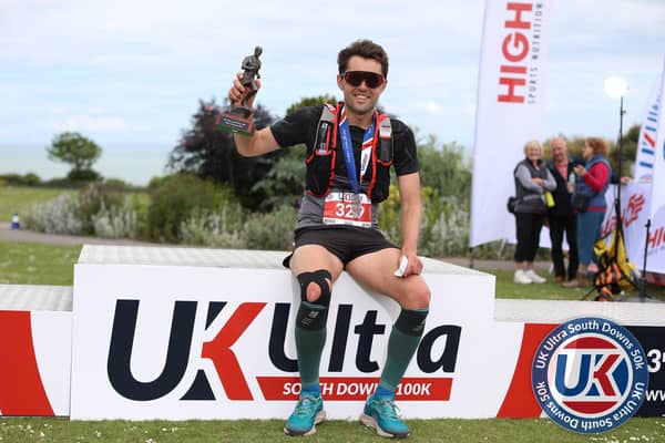 Fareham's Jack Oates with his South Downs 50k winning trophy Picture: Stuart March Photography
