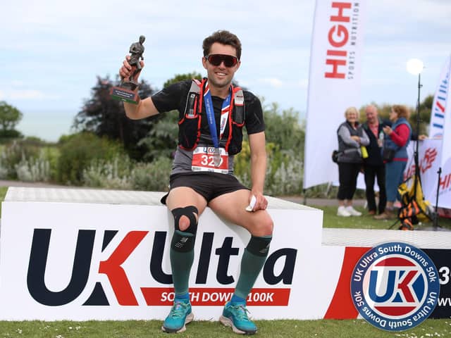 Fareham's Jack Oates with his South Downs 50k winning trophy Picture: Stuart March Photography