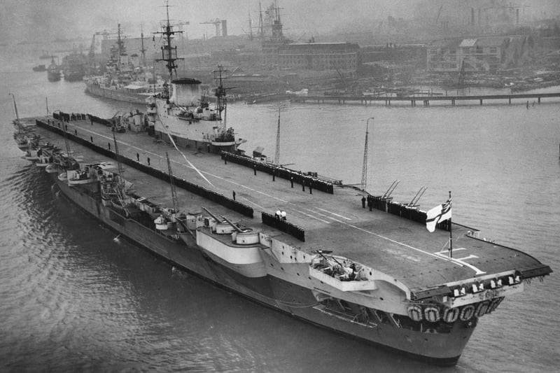 Officers and crew line the flight deck of the Royal Navy Implacable-class aircraft carrier HMS Indefatigable after returning to her home port of Portsmouth following her service in the Far East on 16 March 1946 at Portsmouth, United Kingdom.   (Photo by Central Press/Hulton Archive/Getty Images).