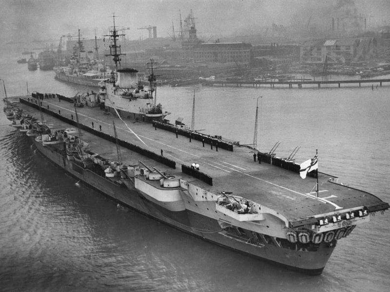 Officers and crew line the flight deck of the Royal Navy Implacable-class aircraft carrier HMS Indefatigable after returning to her home port of Portsmouth following her service in the Far East on 16 March 1946 at Portsmouth, United Kingdom. (Photo by Central Press/Hulton Archive/Getty Images).