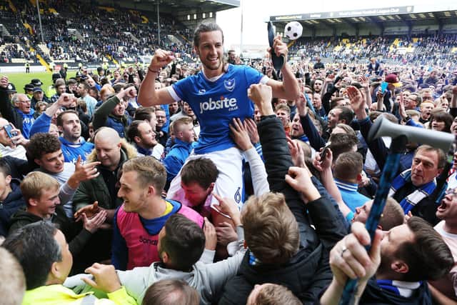 Jamal Lowe came off the bench to score twice in the final 13 minutes at Meadow Lane - and fire Pompey to promotion from League Two. Euphoric Blues followers invaded the pitch at the final whistle and later the team joins supporters in the Victory Lounge at Fratton Park to continue celebrations. Picture: Joe Pepler