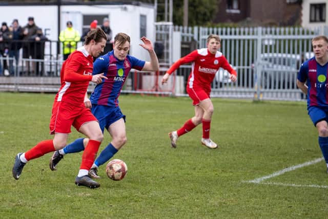 Horndean's Tommy Scutt in action against US Portsmouth. Picture by Alex Shute