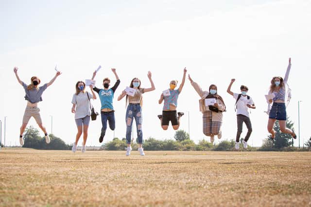 Portsmouth College students jump for joy after being awarded their A-level results.
Picture: Habibur Rahman