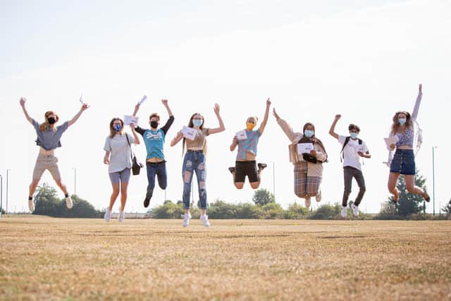 Portsmouth College students jump for joy after being awarded their A-level results.

Picture: Habibur Rahman