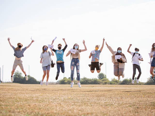 Portsmouth College students jump for joy after being awarded their A-level results.

Picture: Habibur Rahman