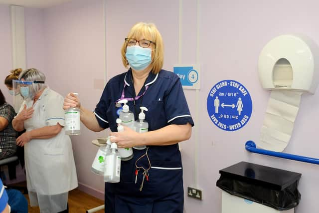 Matron Beverley Bayes restocking the hand sanitisers.
Picture: Sarah Standing (010221-2018)