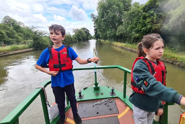 Cubs at the 2nd Gosport Scout Group's steer the boat on their two-night excursion to the Grand Union Canal.