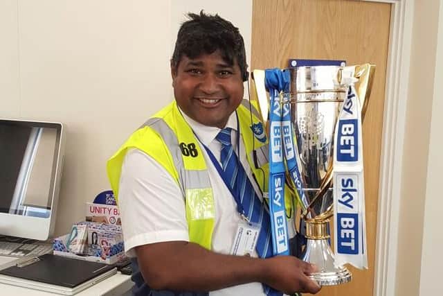 Abdul Khalique, commonly known as 'Abdul the Steward', celebrates Pompey's 2017 League Two title triumph.