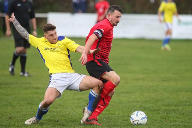 Ryan Chandler, left, was sent off in the first half of Denmead's Russell Cotes Cup loss at US Portsmouth.

Picture: Stuart Martin