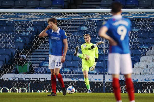 Pompey's players are dejected after Hull score their fourth goal in Saturday's top-of-the-table clash at Fratton Park. Picture: Joe Pepler