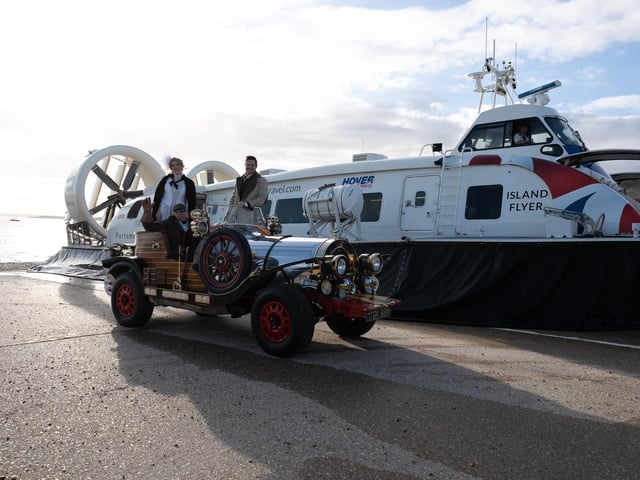 Pictured is: Caractacus Potts with Truly Scrumptious and the owner of the car, Nick Pointing, at the Hover Terminal.