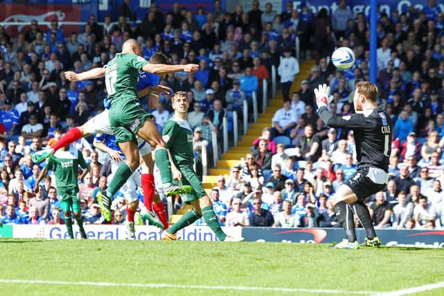 Danny Hollands heads home the first of his hat-trick goals against Plymouth in May 2014. Picture: Joe Pepler