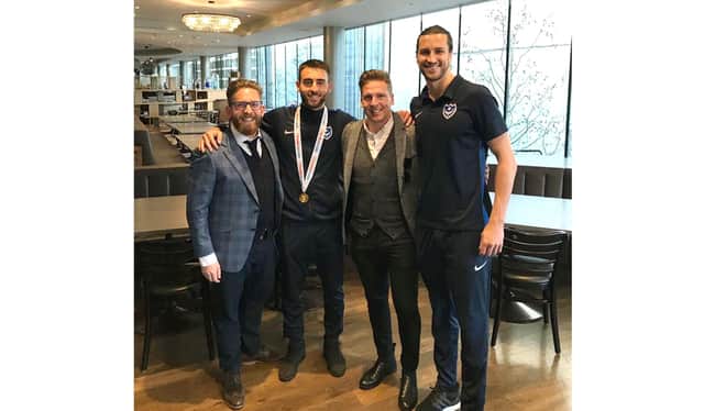 Agents Phil Korklin (far left) and Brian Howard (second right) pose with clients Ben Close and Christian Burgess after the 2019 Checkatrade Trophy final