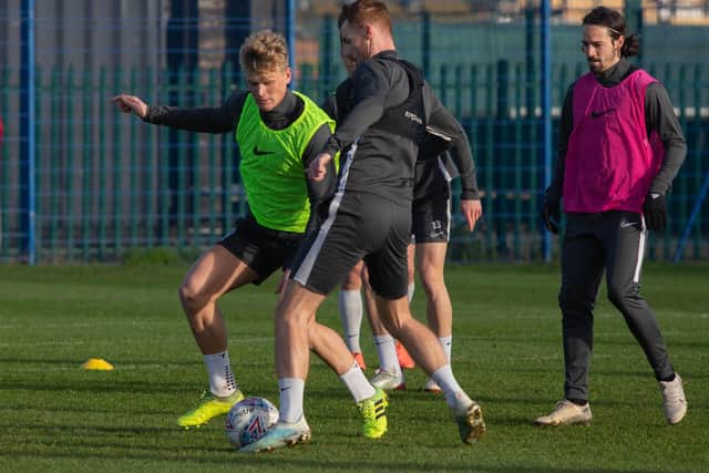Cameron McGeehan and Tom Naylor battle in training. Picture: Habibur Rahman