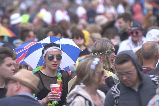 Festival goers brave the wet weather during the 2019 Isle of Wight Festival at Seaclose Park, Newport. Picture: Ed Lawrence/PA Wire