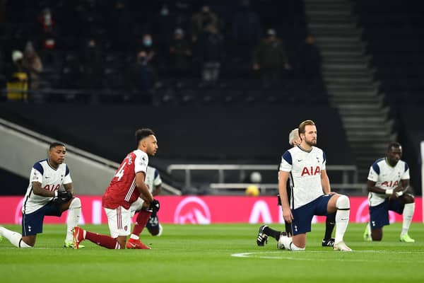 Pierre-Emerick Aubameyang of Arsenal and Harry Kane and Steven Bergwijn of Tottenham Hotspur take a knee in support of the Black Lives Matter last December. Photo by Glyn Kirk - Pool/Getty Images.