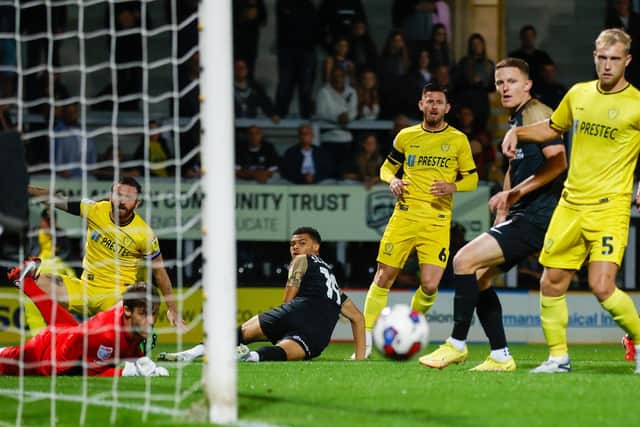 Dane Scarlett watches a first-half attempt flash across the face of goal during Pompey's trip to Burton. Picture: Simon Davies/ProSportsImages