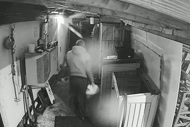 Screenshot of thieves stealing cooking oil from the Horse and Jockey pub in Fareham Road, Denmead, in the early hours of May 5.