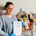 Gosport Borough FC volunteer Gaynor Wilkinson with food parcels donated by Morrisons. Picture by Keith Slater
