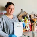 Gosport Borough FC volunteer Gaynor Wilkinson with food parcels donated by Morrisons. Picture by Keith Slater