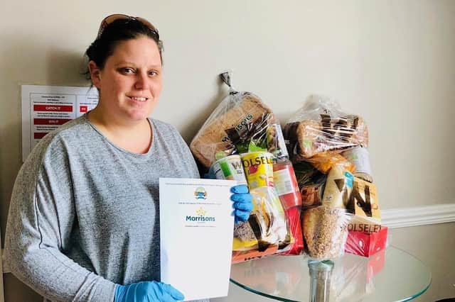 Gosport Borough FC volunteer Gaynor Wilkinson with food parcels donated by Morrisons. Picture by Keith Slater