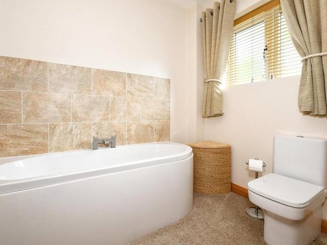 Also on the first floor is this family bathroom. Modern and stylish would be the best way to describe it.